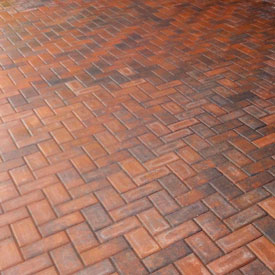 Brick pavers in herringbone pattern.